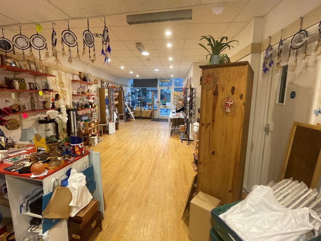 Lot: 45 - TOWN CENTRE PROPERTY WITH VACANT UPPER PARTS - Shop floor looking out towards Cannon Street